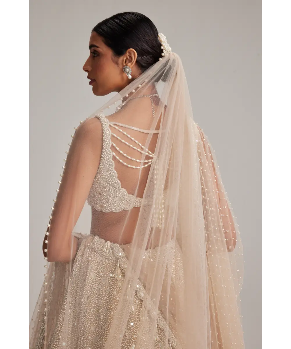 VVANI VATS- Light Beige Dense mirror and pearl lehenga set with Double Dupatta and Veil